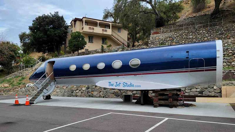 Private jet set with its hydraulic boarding door open