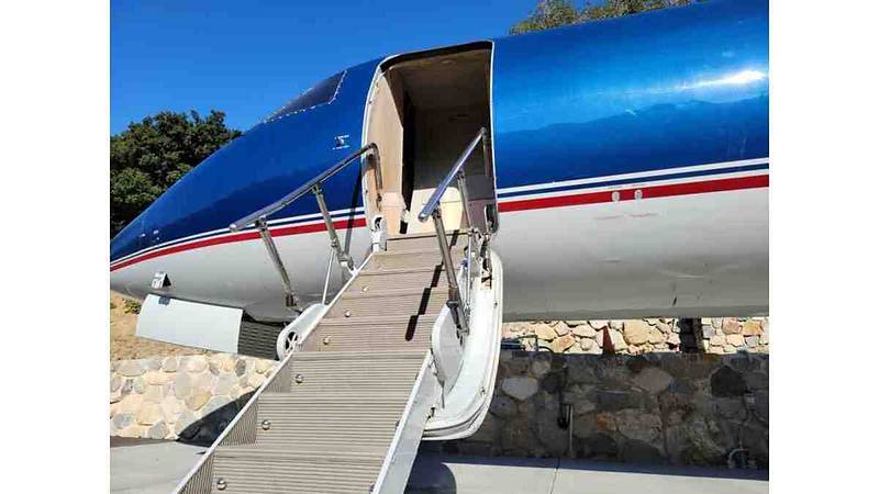 Close-up of the private jet's boarding stairs, open