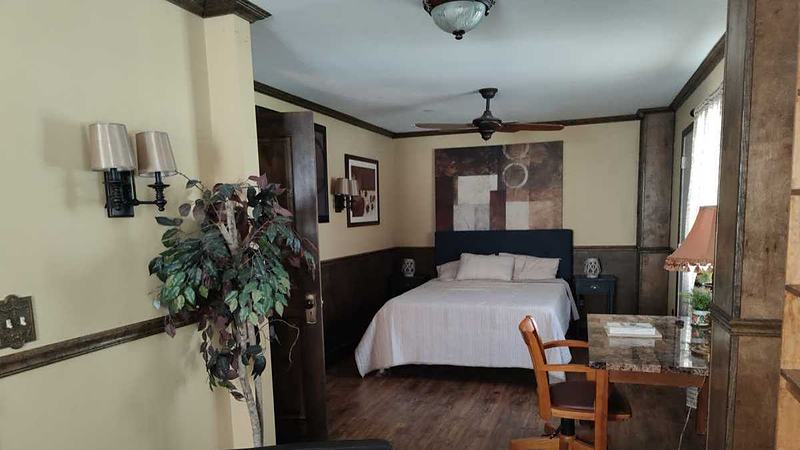 larger bedroom with attached sitting area