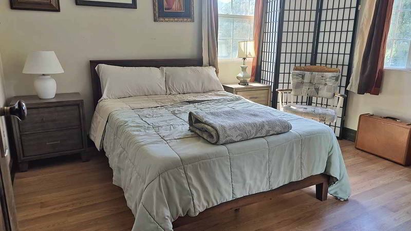 Small bedroom with 2 corner windows for light