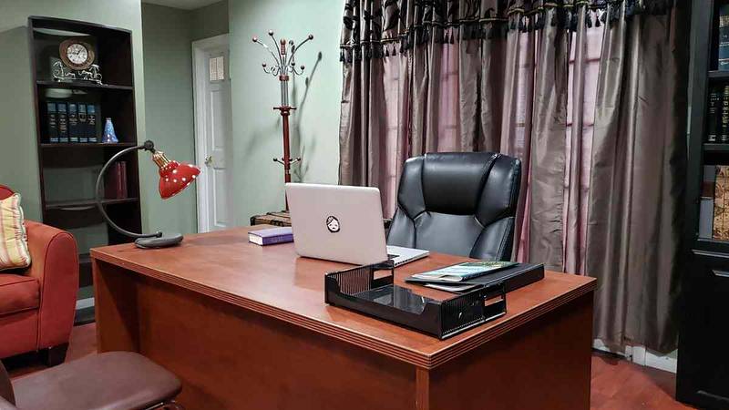 Executive office with a bookcase and side entrance