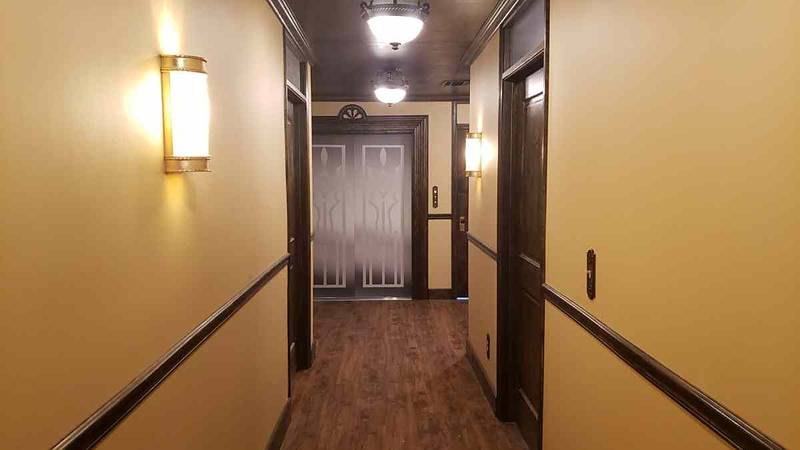 Vintage hallway inside the motel set, reverse view