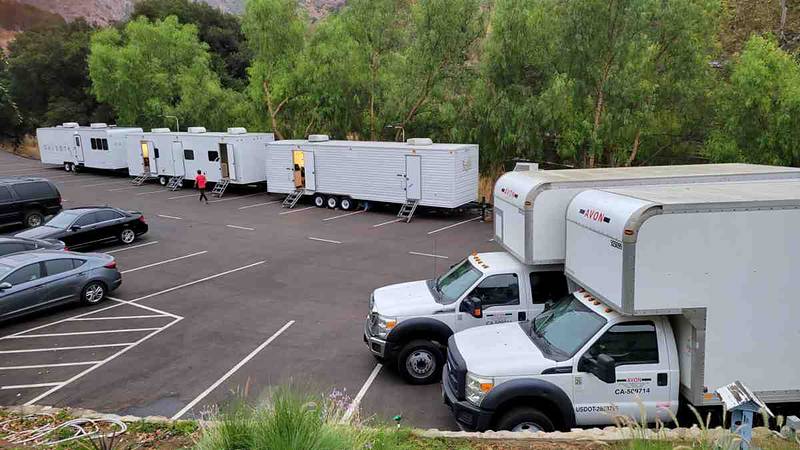 Production trucks and trailers in the lower parking lot