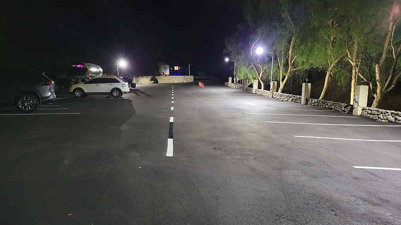 Lower parking lot and street at night