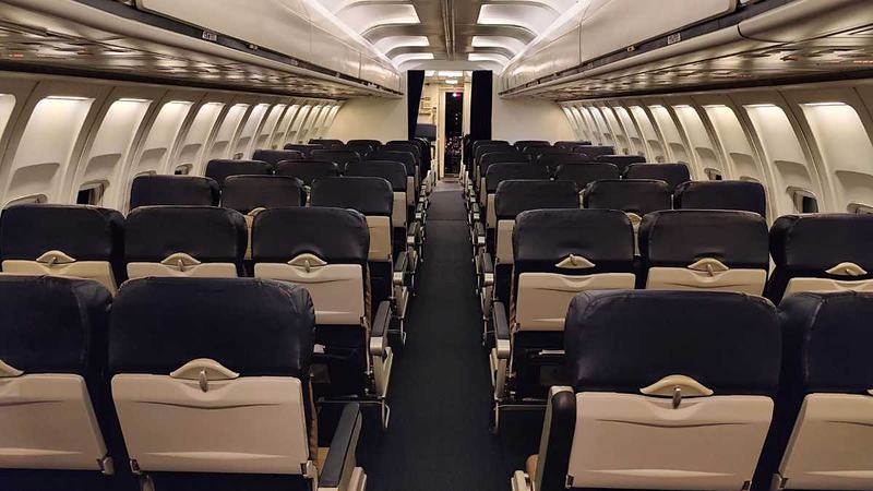 full length view of the jet isle looking from the rear section through the coach and first class sections and can see the cockpit too