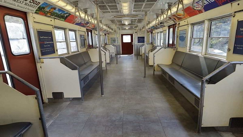 Subway car interior looking toward the rear