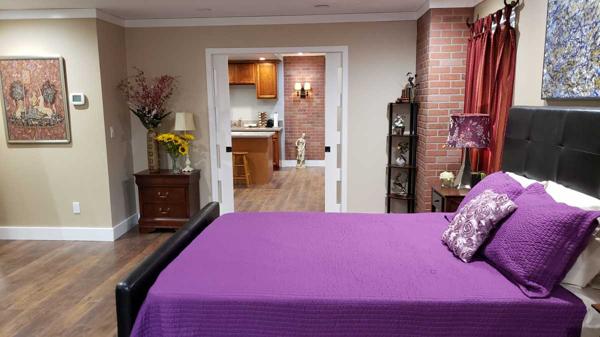 Spacious bedroom with brick columns.