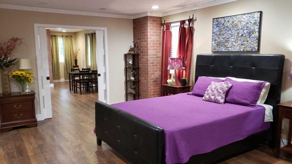 Spacious bedroom with brick columns.