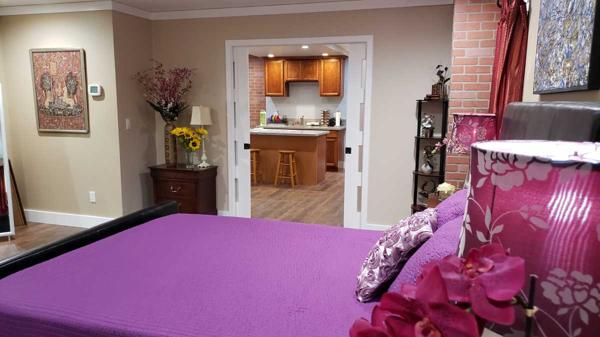 Spacious bedroom with brick columns.