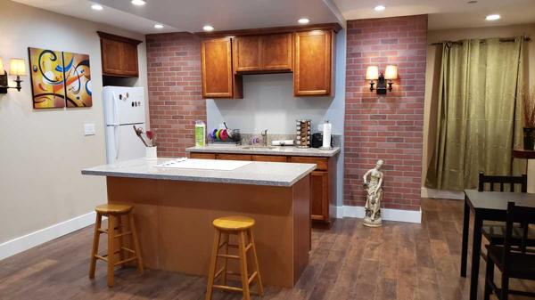 Spacious bedroom with brick columns.
