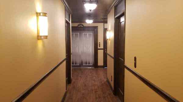 wood ceilings over a vintage office hallway filming location